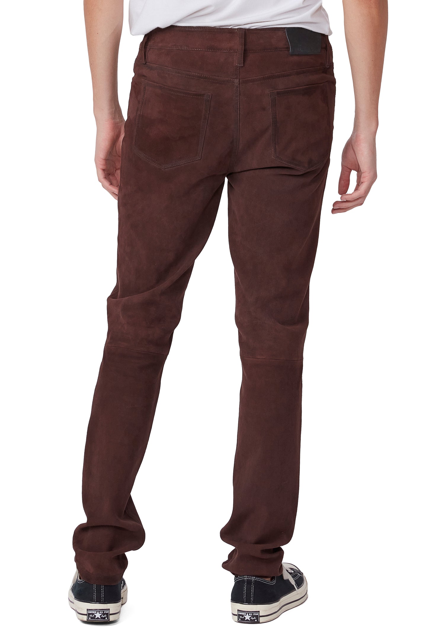 Brown pants worn by a person on a white background