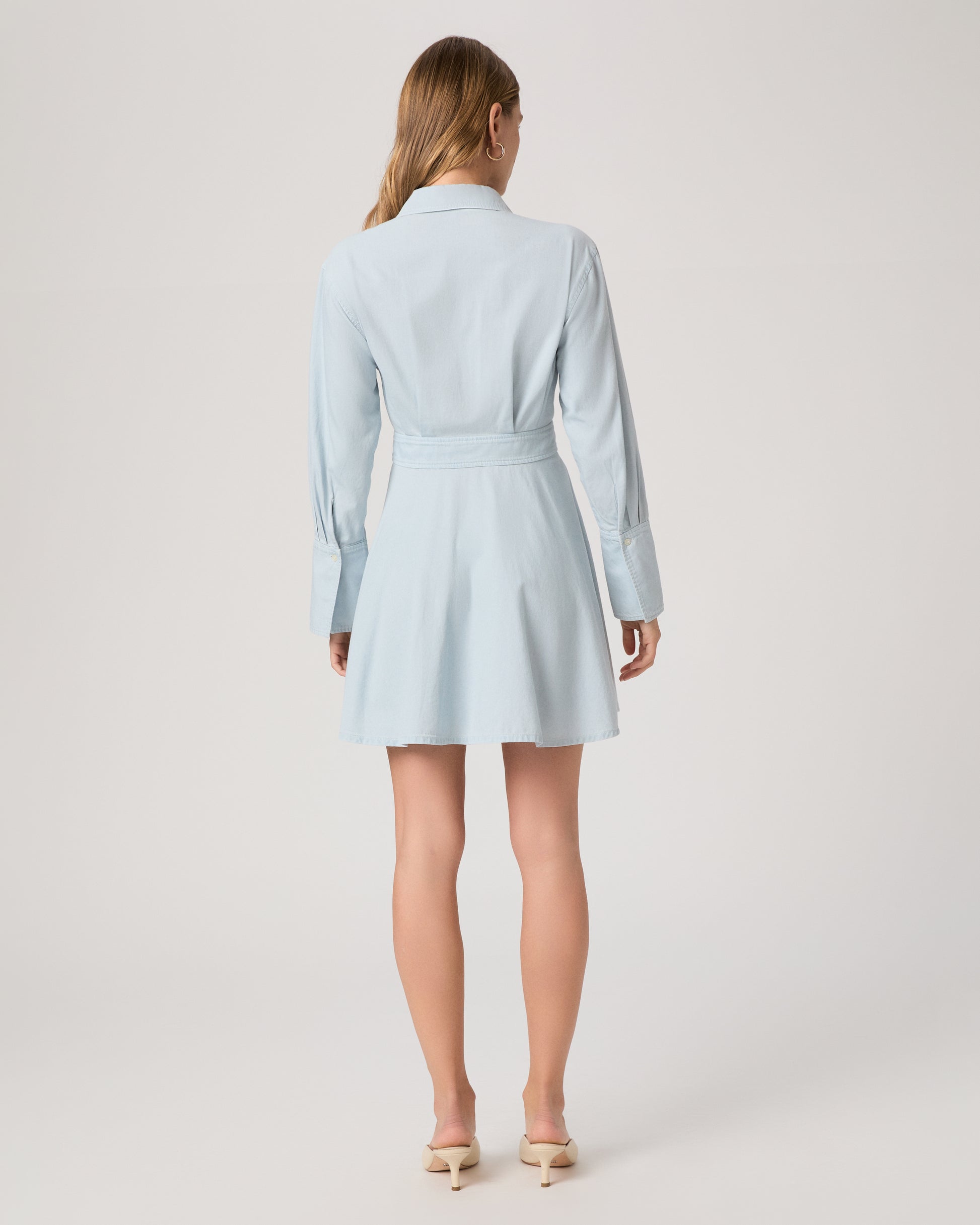 Light blue dress worn by a model on a plain background