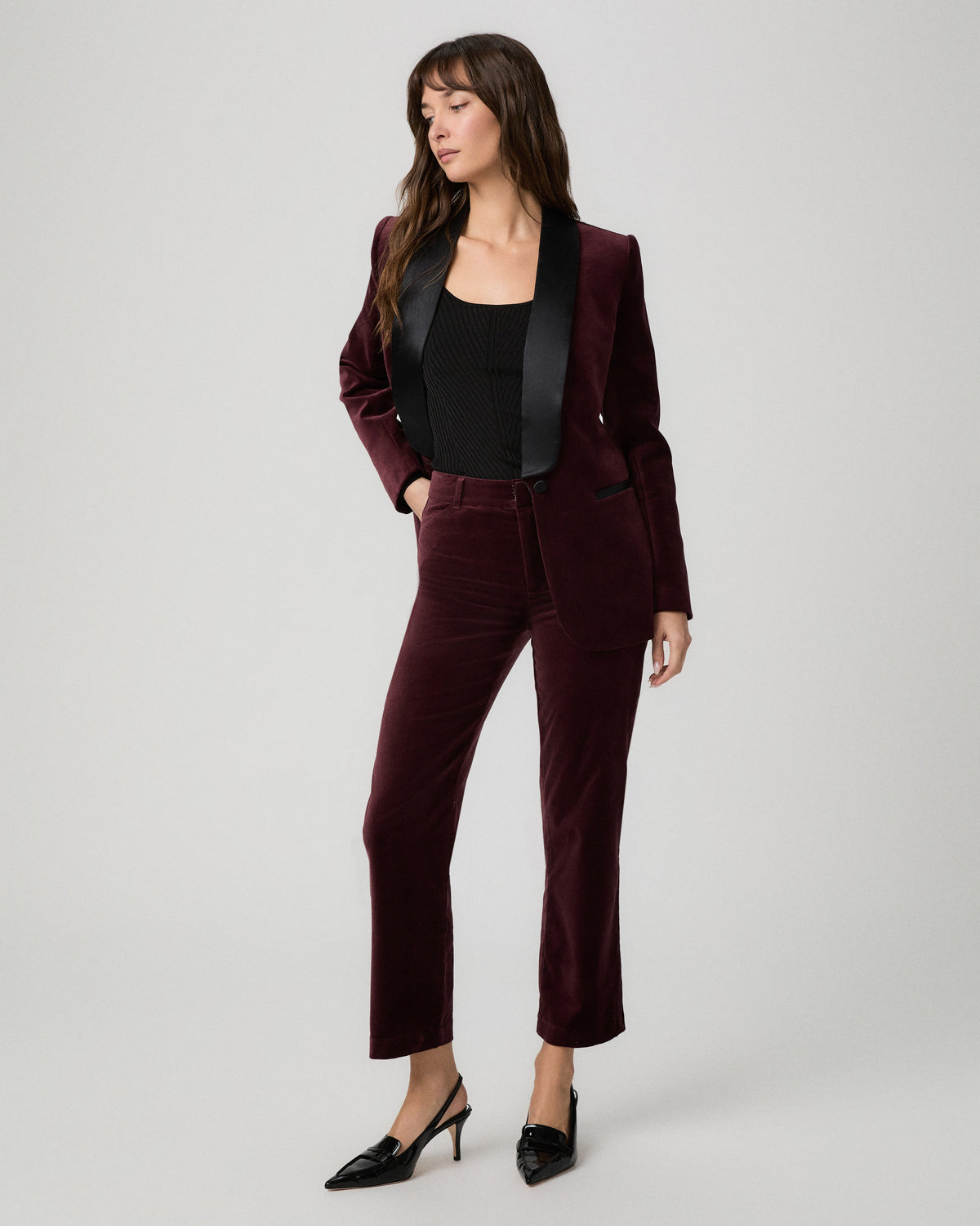 Model wearing the Stevie Crop Trouser in merlot velvet with a matching merlot velvet blazer