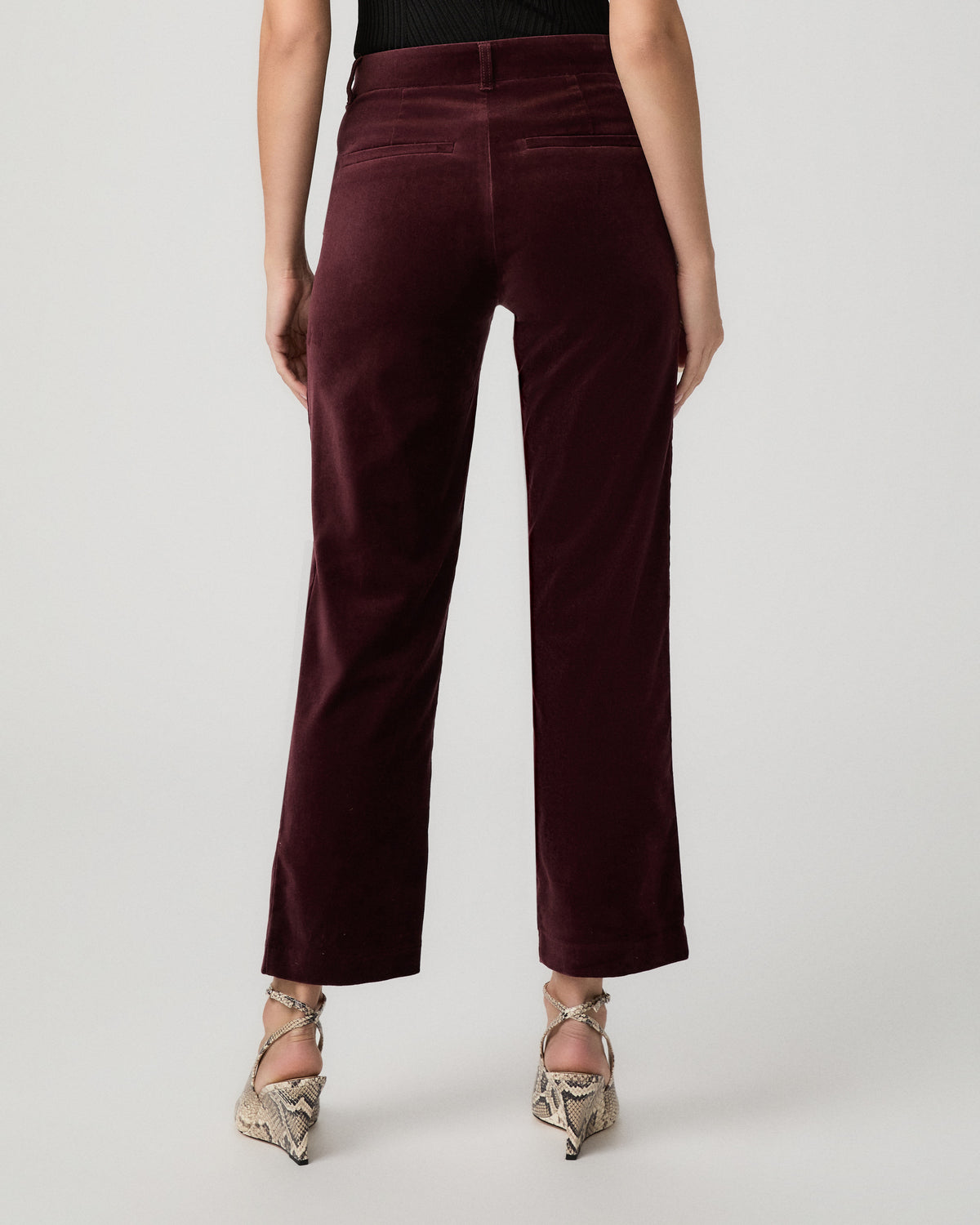 Back view of the Stevie Crop Trouser in merlot velvet showing the cropped straight-leg fit