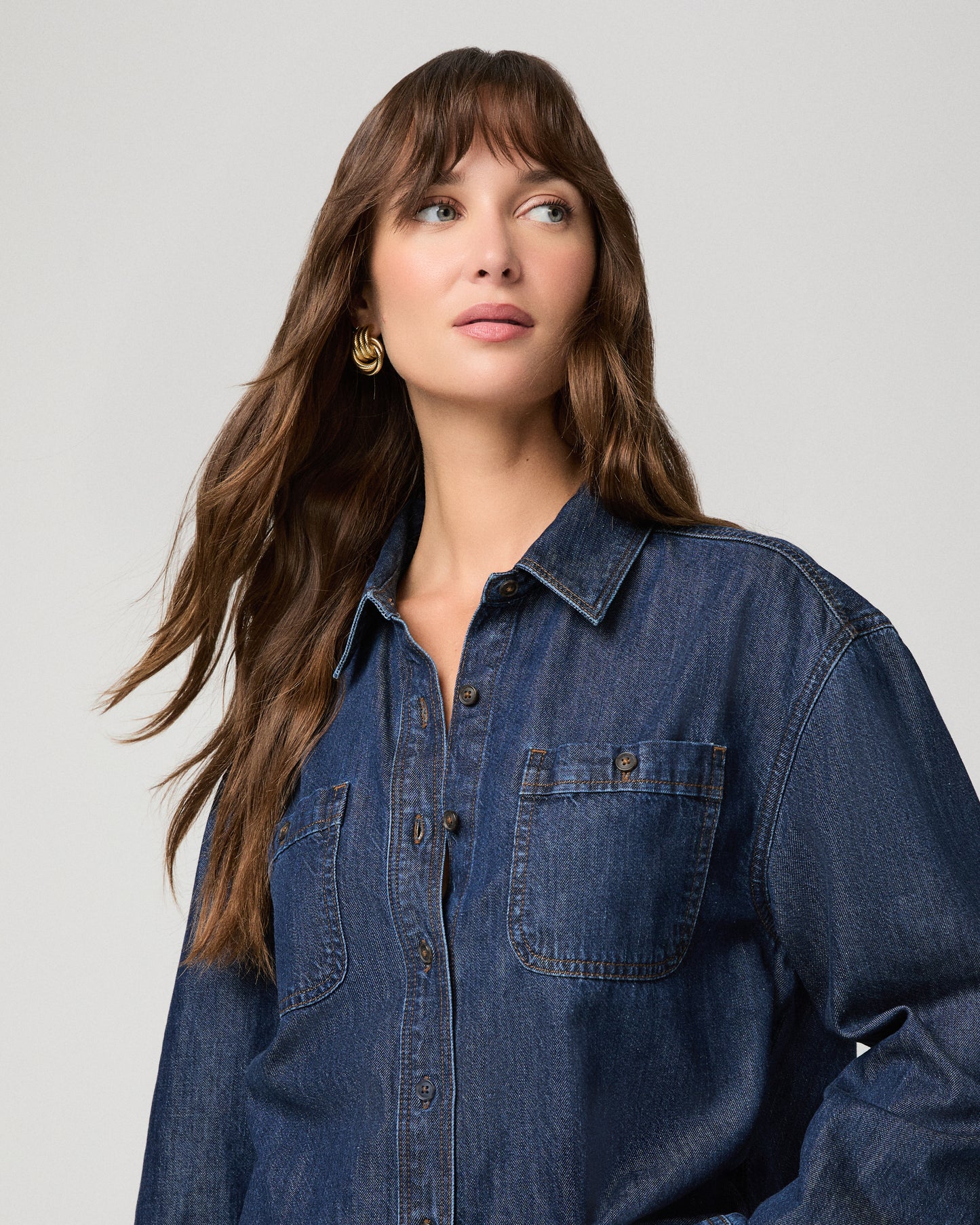 Woman wearing a dark denim top