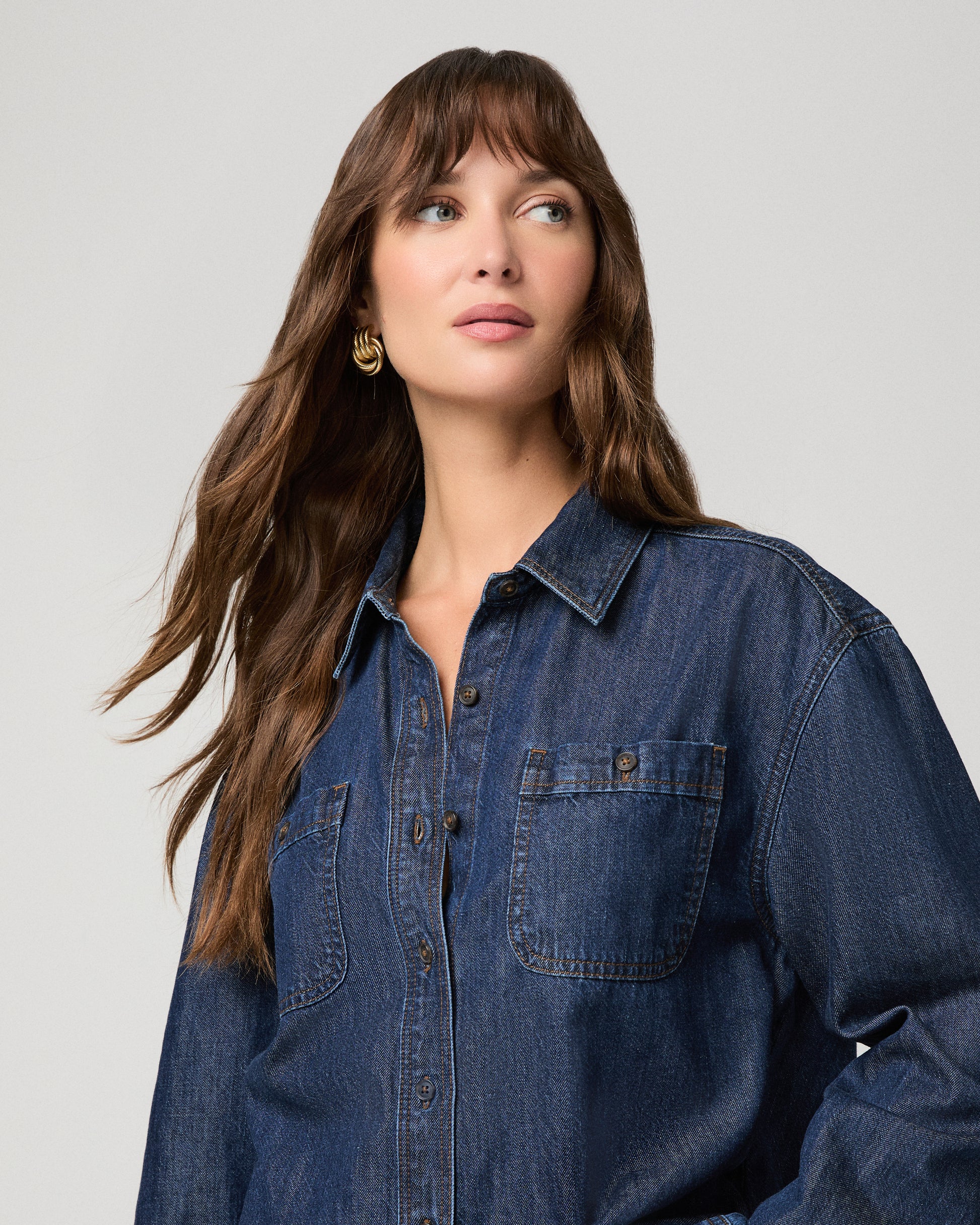 Woman wearing a dark denim top