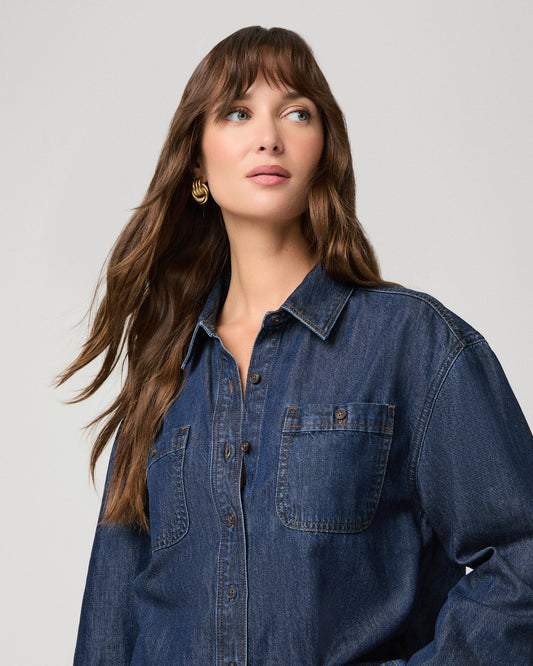 Woman wearing a dark denim top