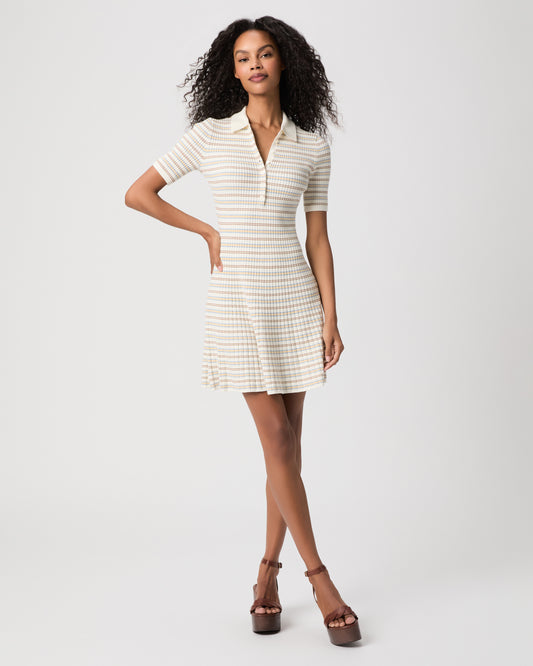 women wearing a mini white stripped dress with brown heels against a white background 