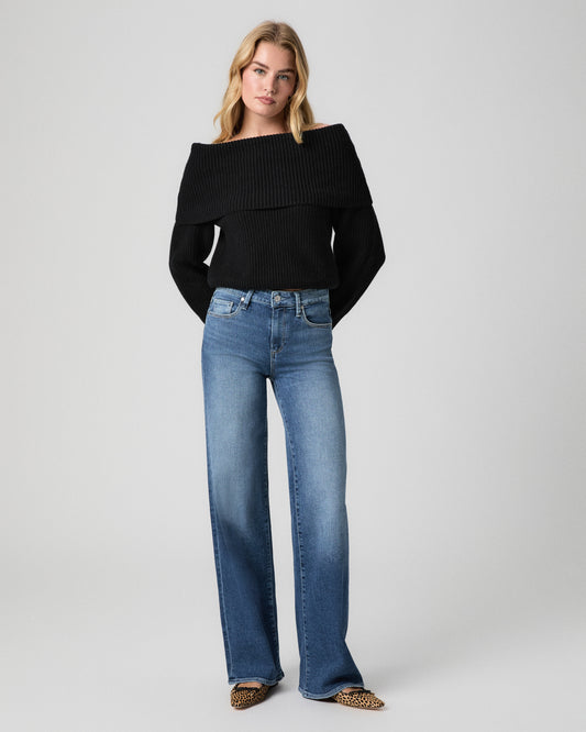 Tatum 32 Inch Wide Leg Jean in Cresthaven medium wash; model stands facing forward in a black fold-over collar sweater and leopard print flats