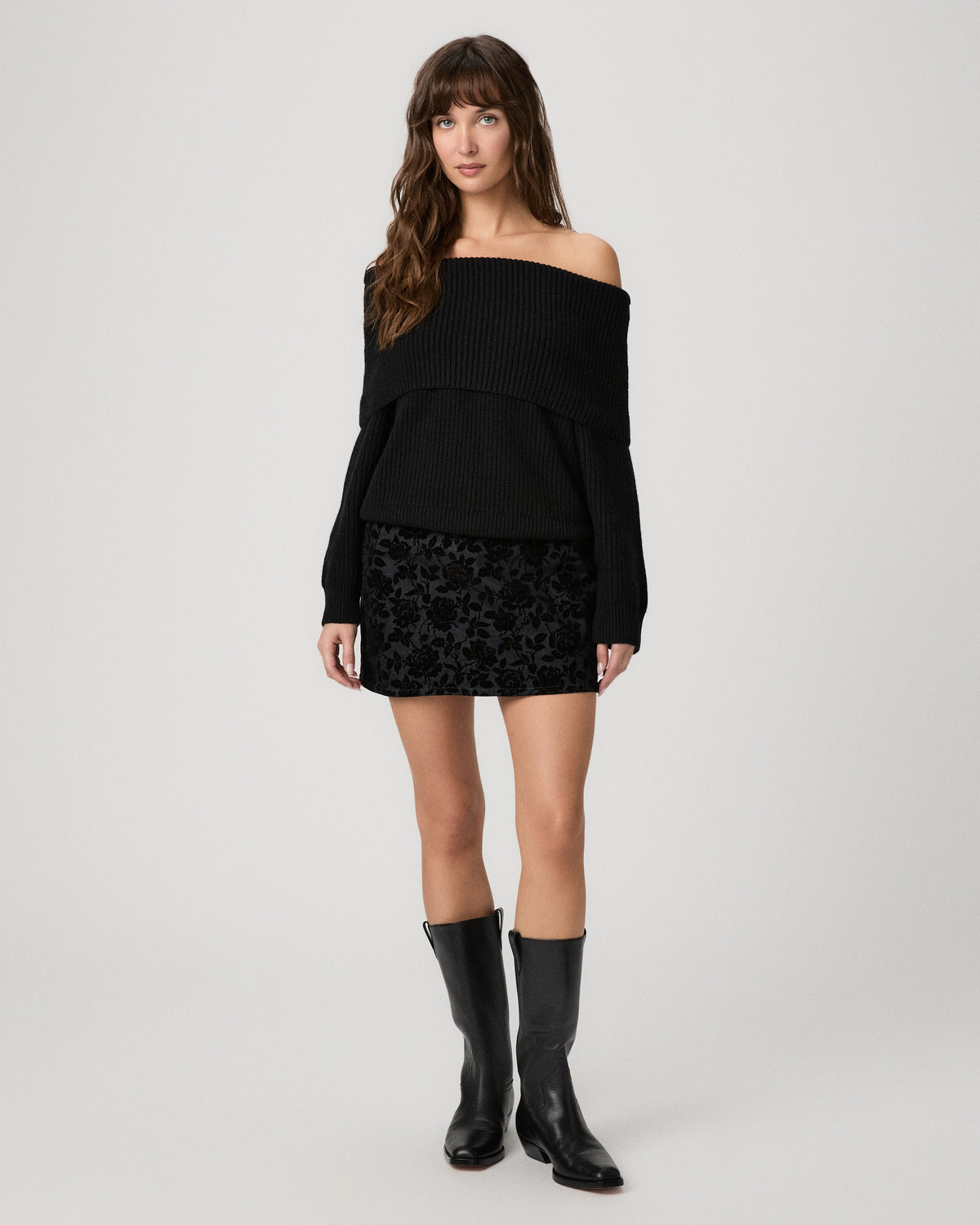 Tinsley Skirt in floral flock denim worn with an off-the-shoulder black sweater and black knee-high boots