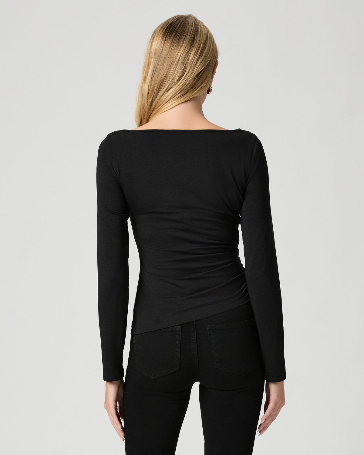Back view of model wearing the Marianna Top in Black with black jeans