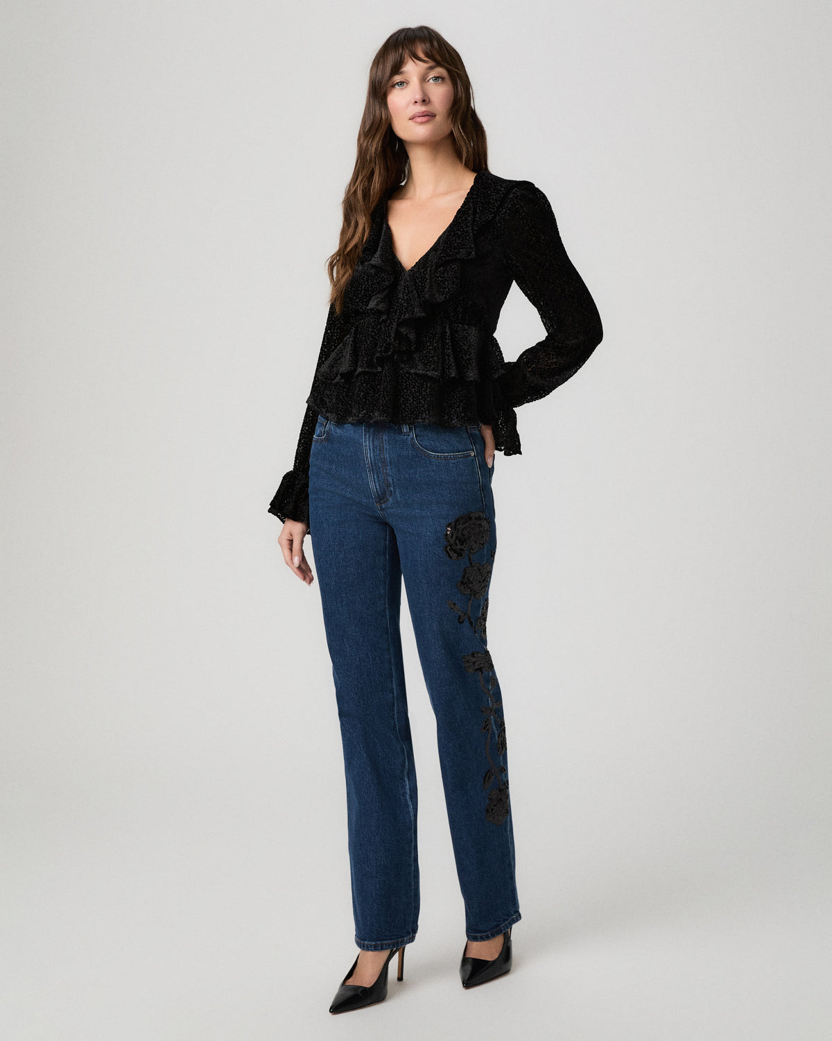 Aurelie Blouse in black styled with blue straight-leg jeans and black heels
