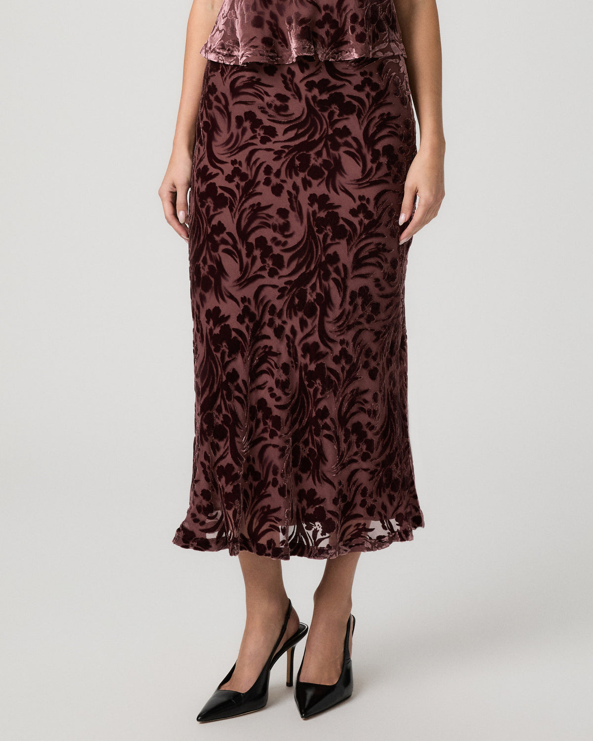 Front close-up of the Rylie Skirt, a merlot velvet burnout midi skirt with a sheer floral pattern