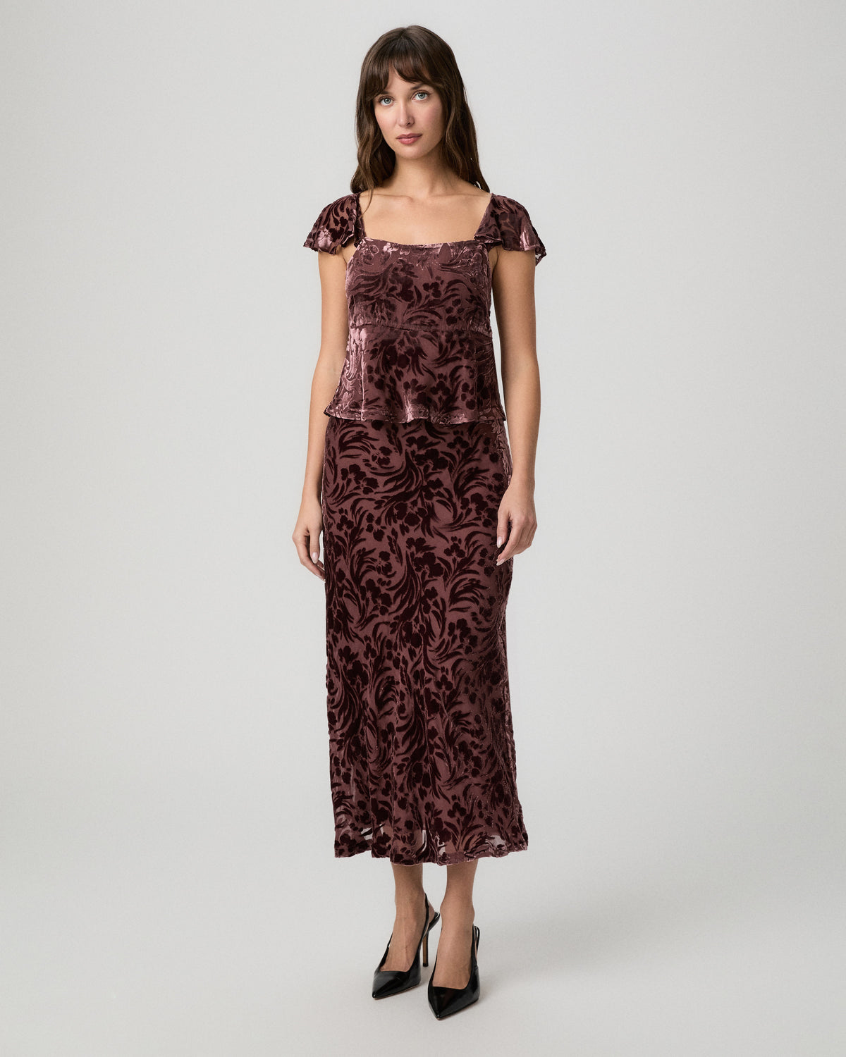 Full-length view of the Rylie midi skirt in merlot velvet burnout with a matching flutter-sleeve top