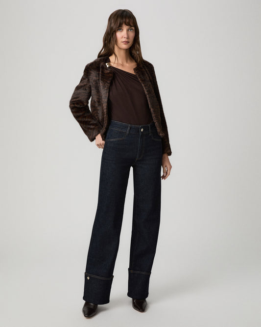 Model wearing the Sasha 32 Inch Wide Leg Jean in Times dark wash with a brown leather jacket and leopard-print heels
