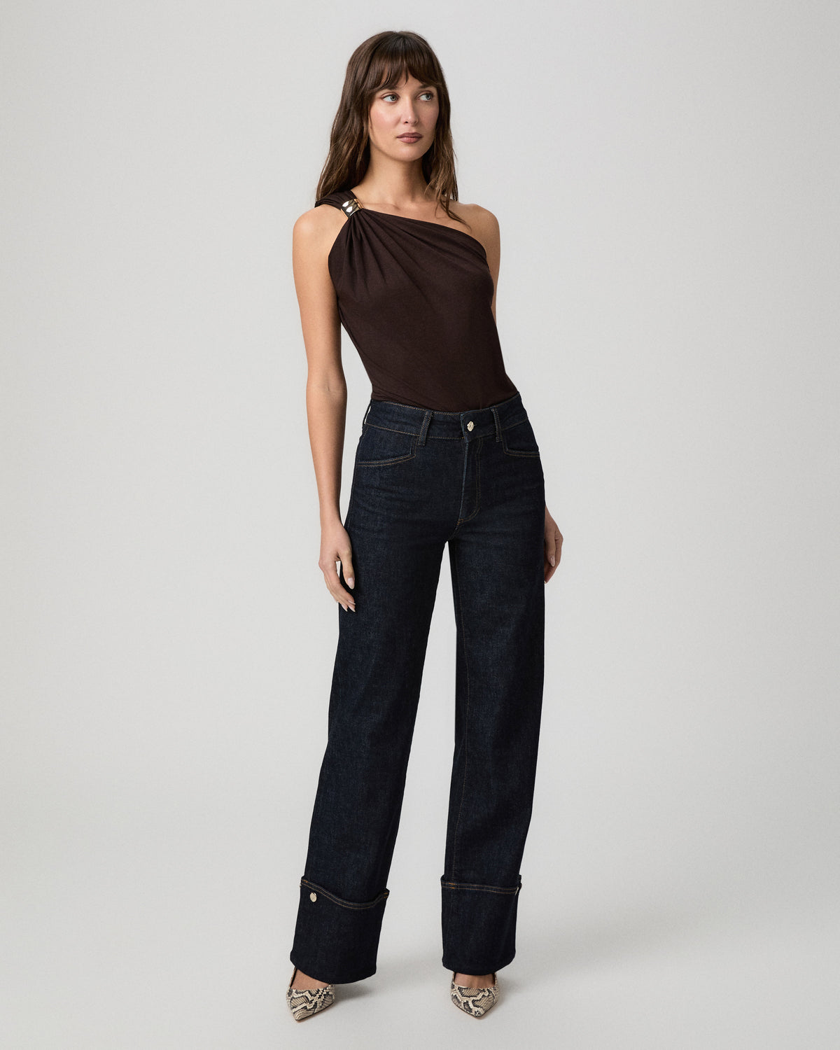 Full-length view of the Sasha Wide Leg Jean in Times dark wash styled with a brown one-shoulder top