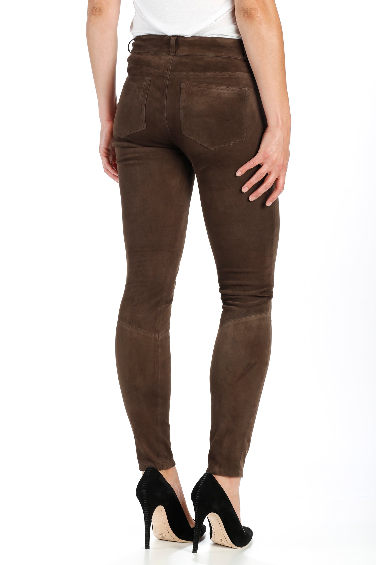 Brown pants worn by a person on a white background