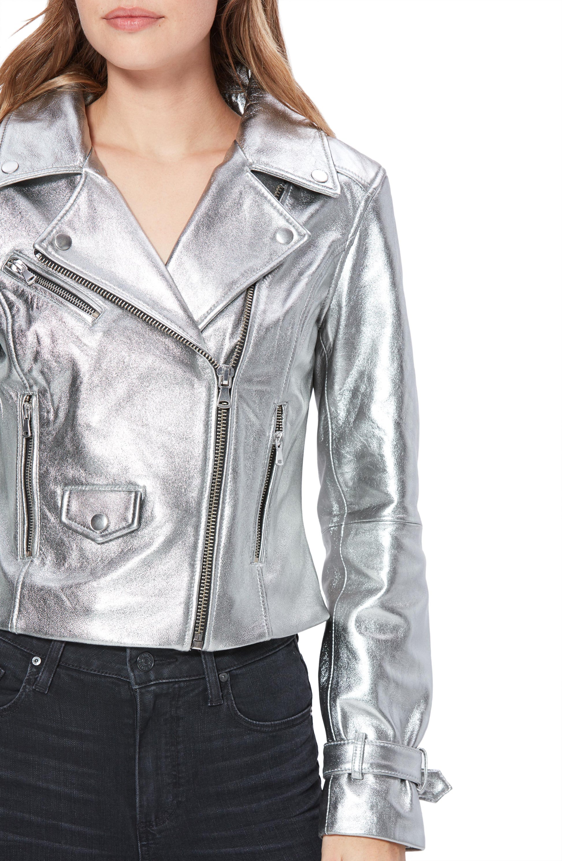 Silver leather jacket worn by a person on a white background