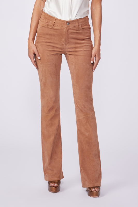 Brown pants worn by a person on a white background