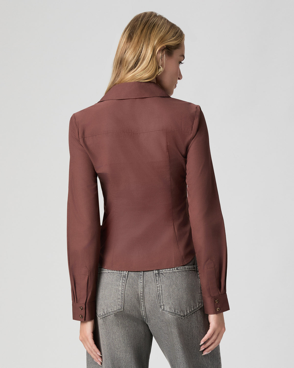 Back view of the Alera Shirt in French Press brown, worn with grey jeans