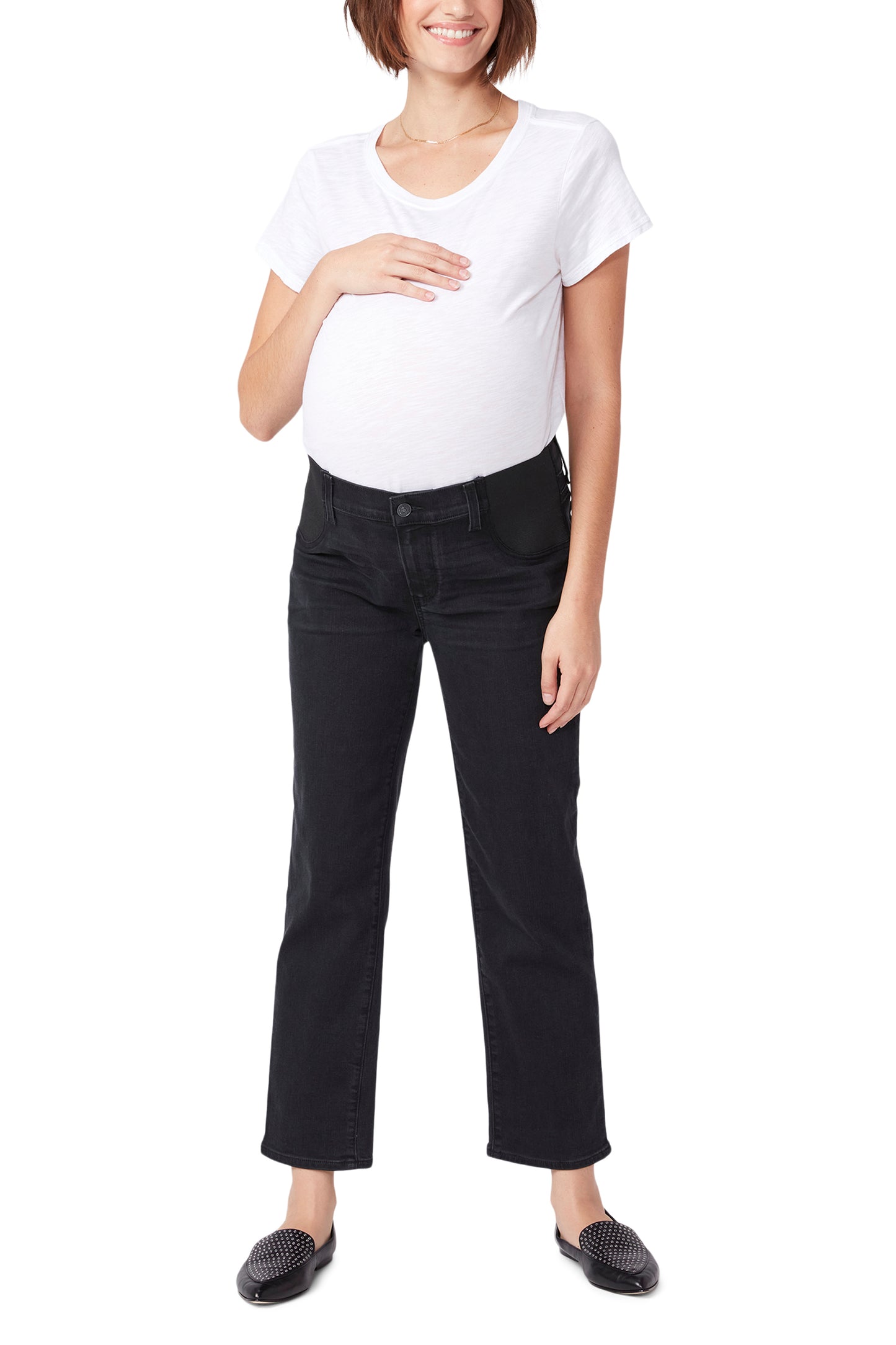 Pregnant woman wearing a white t-shirt and black pants on a white background