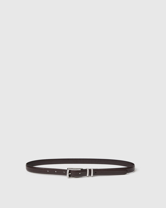 Chocolate belt with silver buckle on a light gray background.
