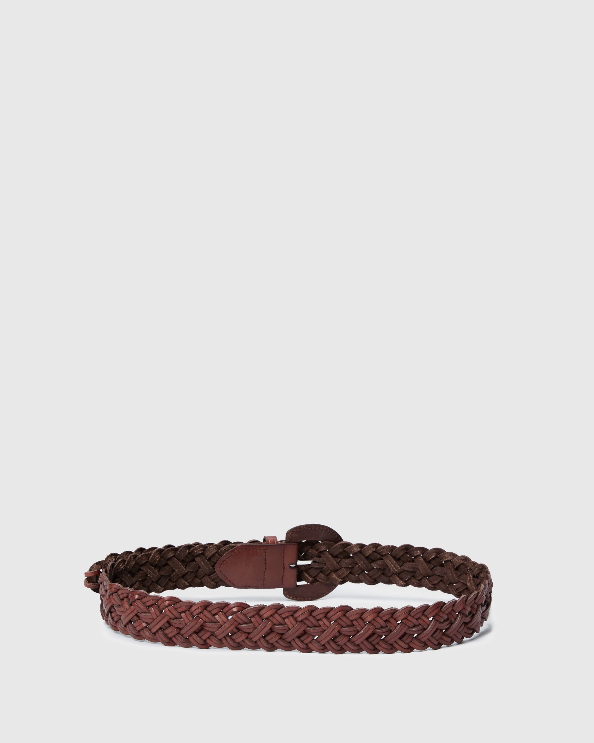 Brown braided belt with a buckle on a light gray background