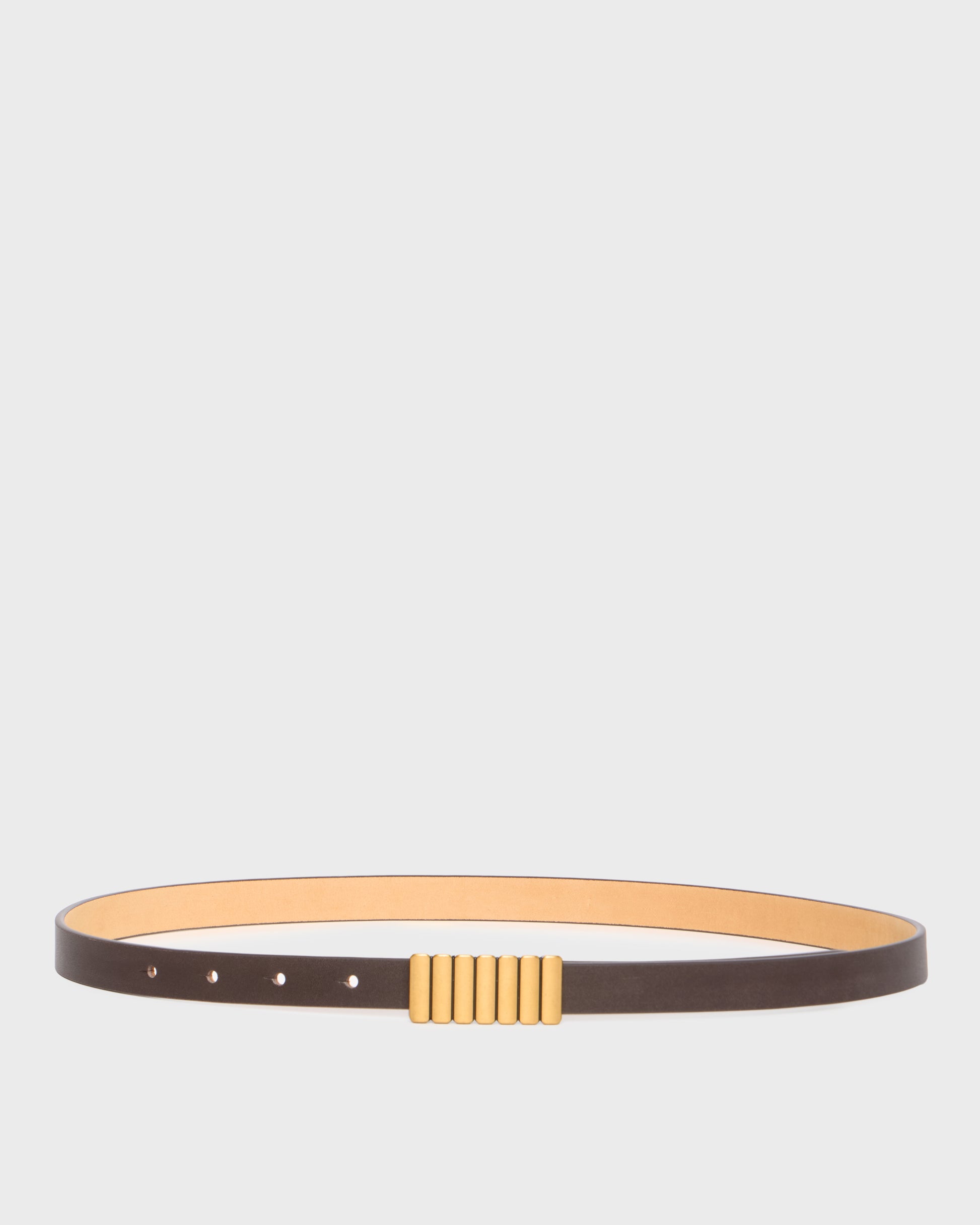 A slim dark brown leather belt with a gold-toned ribbed rectangular buckle, displayed horizontally against a light gray background.
