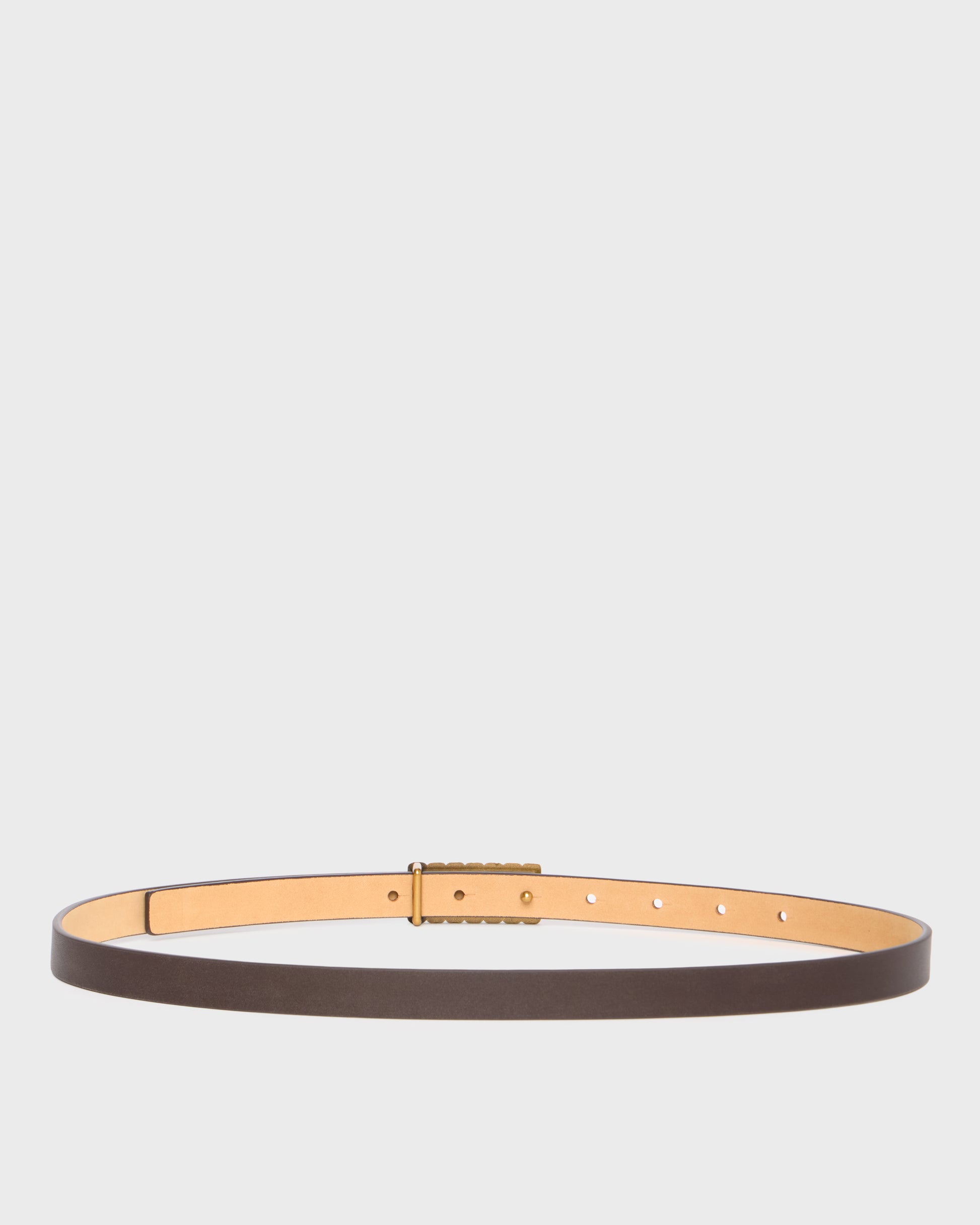 A slim brown leather belt with a gold-tone buckle and matching gold-tone inner lining, displayed horizontally against a light gray background.