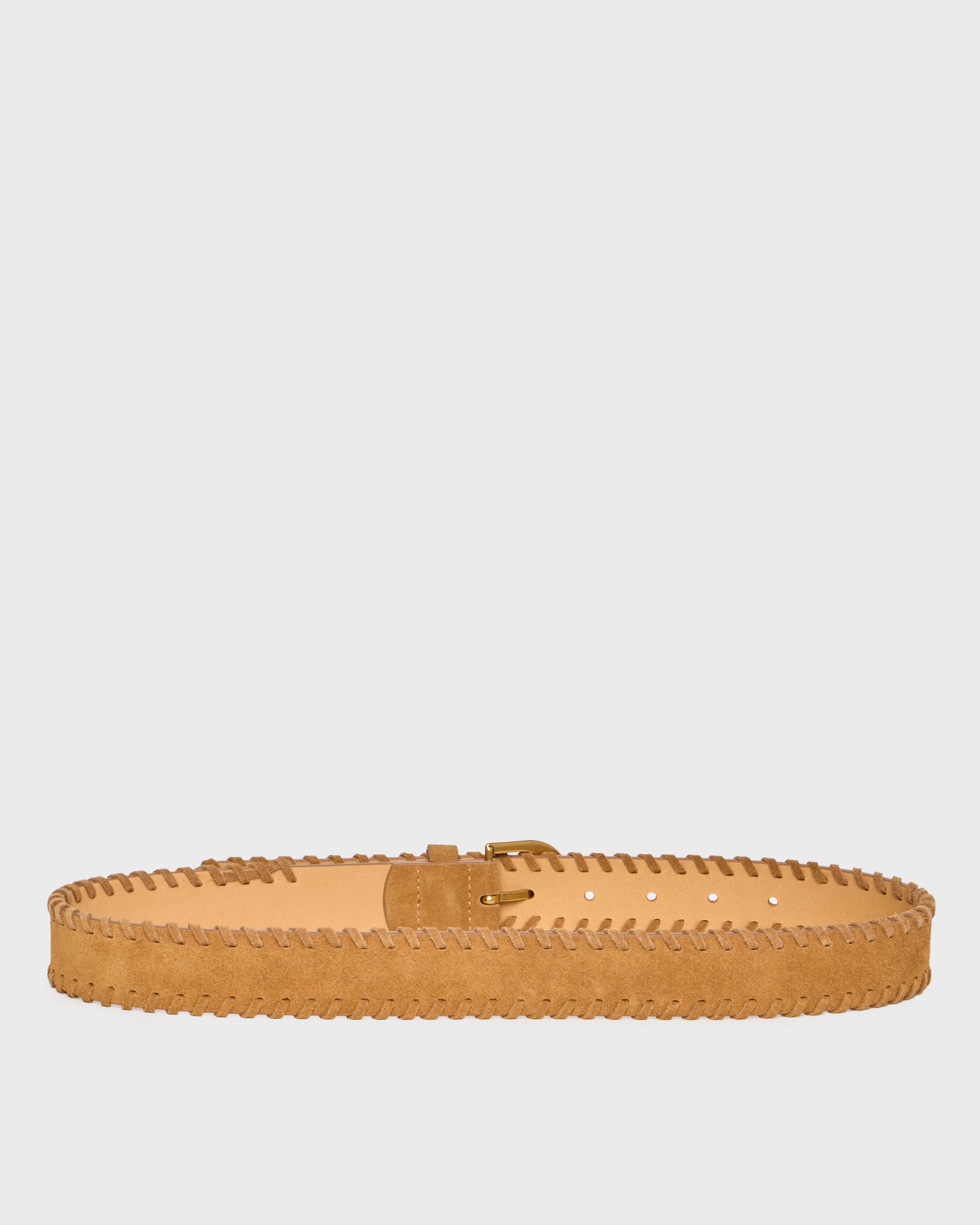 A light tan suede belt with decorative zigzag stitching along the edge and a matching buckle, displayed horizontally against a solid light gray background.
