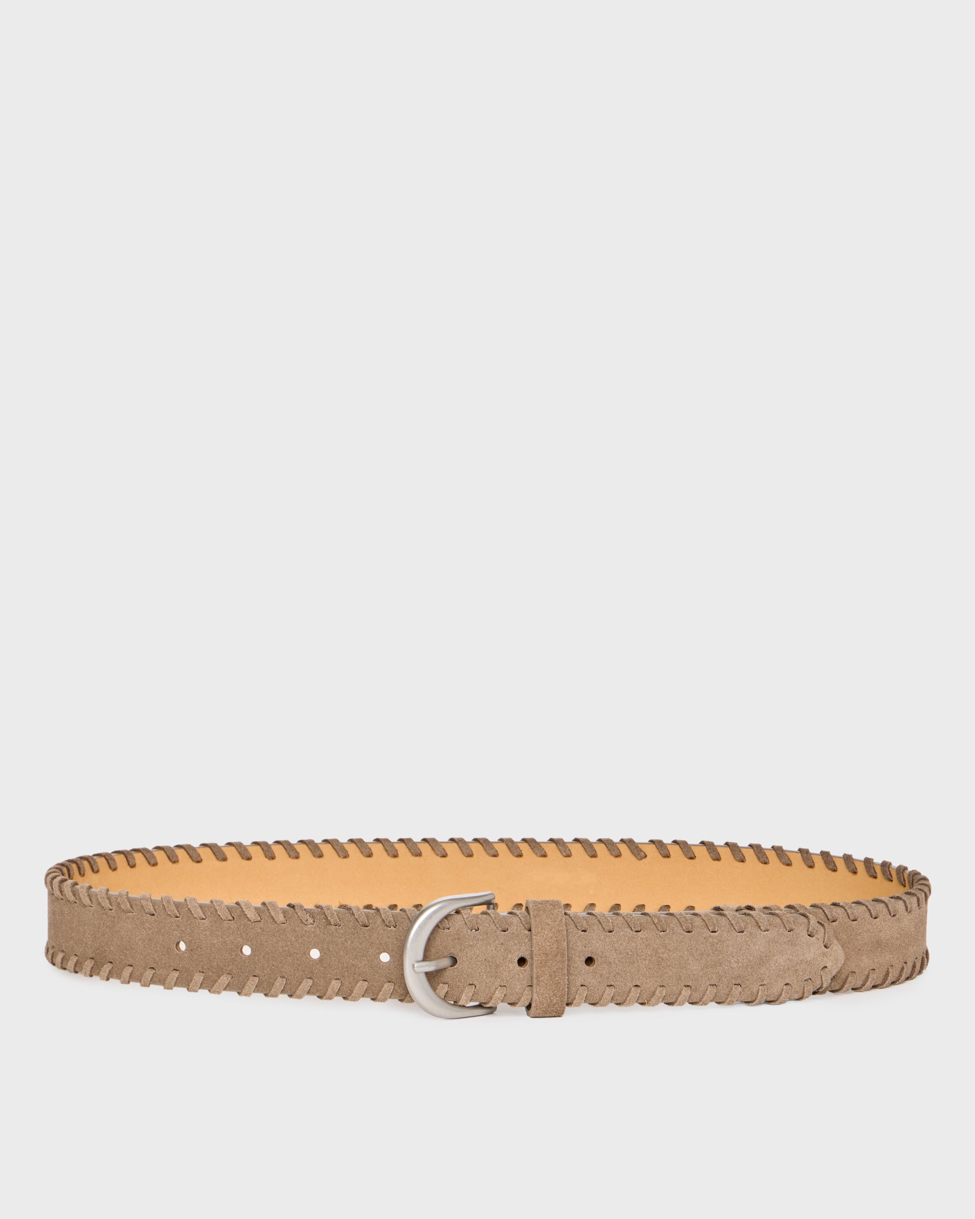A light brown suede belt with a zigzag stitched edge and a silver metal buckle, displayed horizontally against a light gray background.