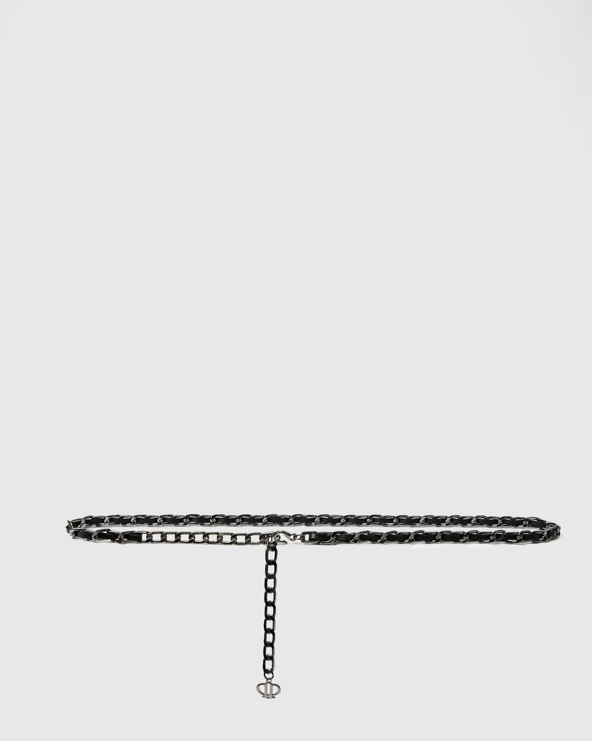 A dark metallic chain link bracelet with a small lobster clasp and a tiny charm, displayed on a light gray background.