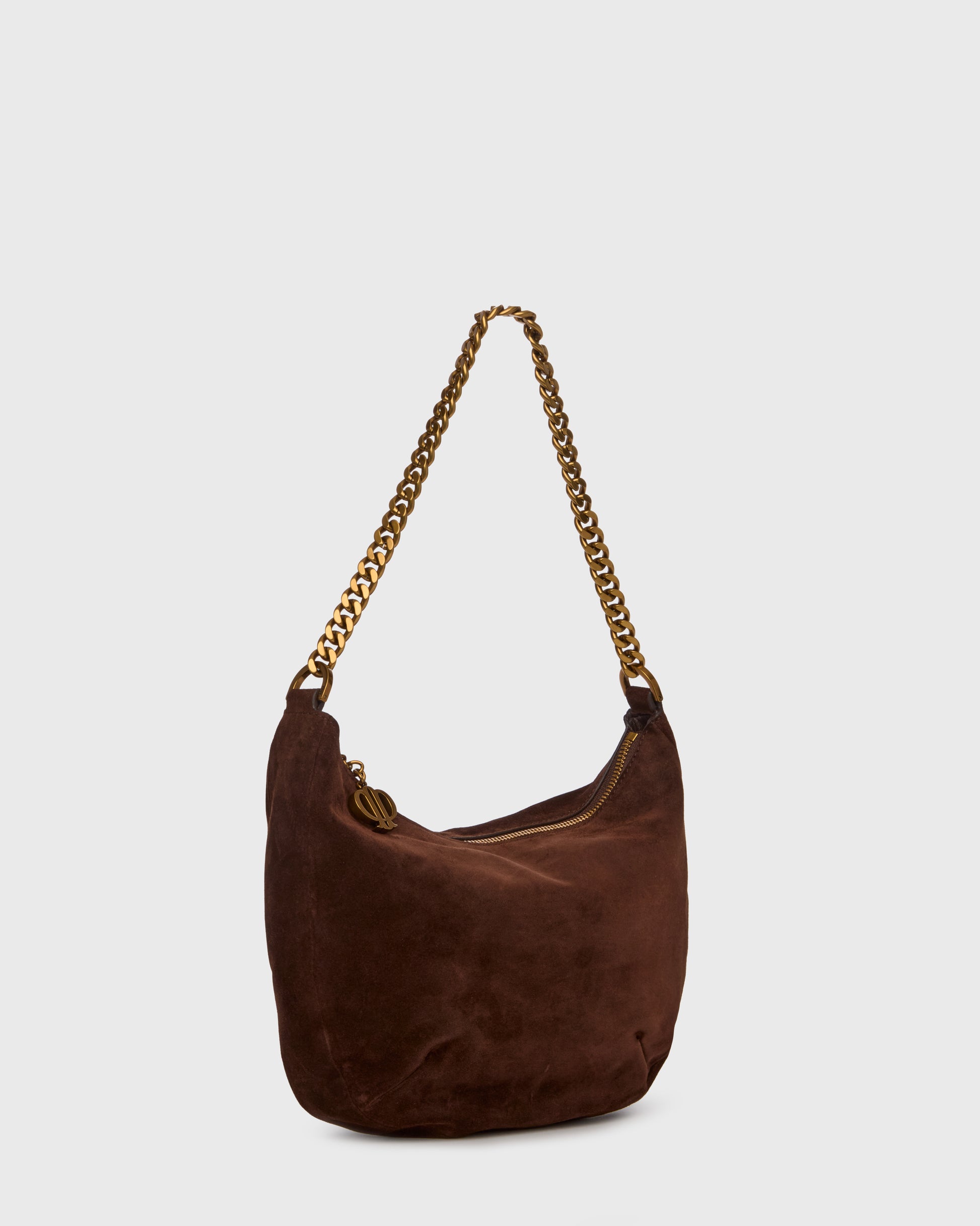 A dark brown suede hobo shoulder bag with a gold-tone chain strap, shown against a light gray background.