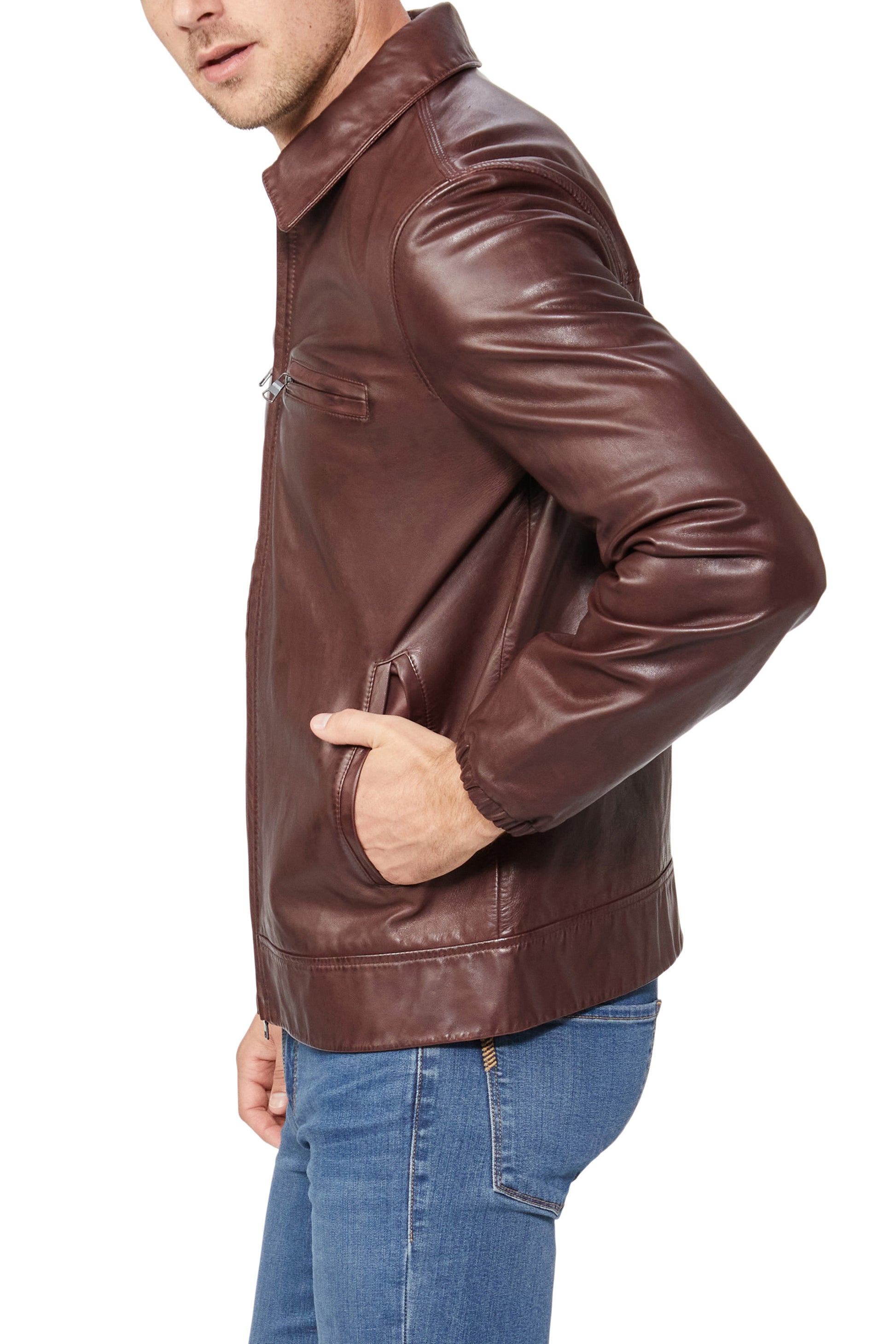 Brown leather jacket worn by a person on a white background