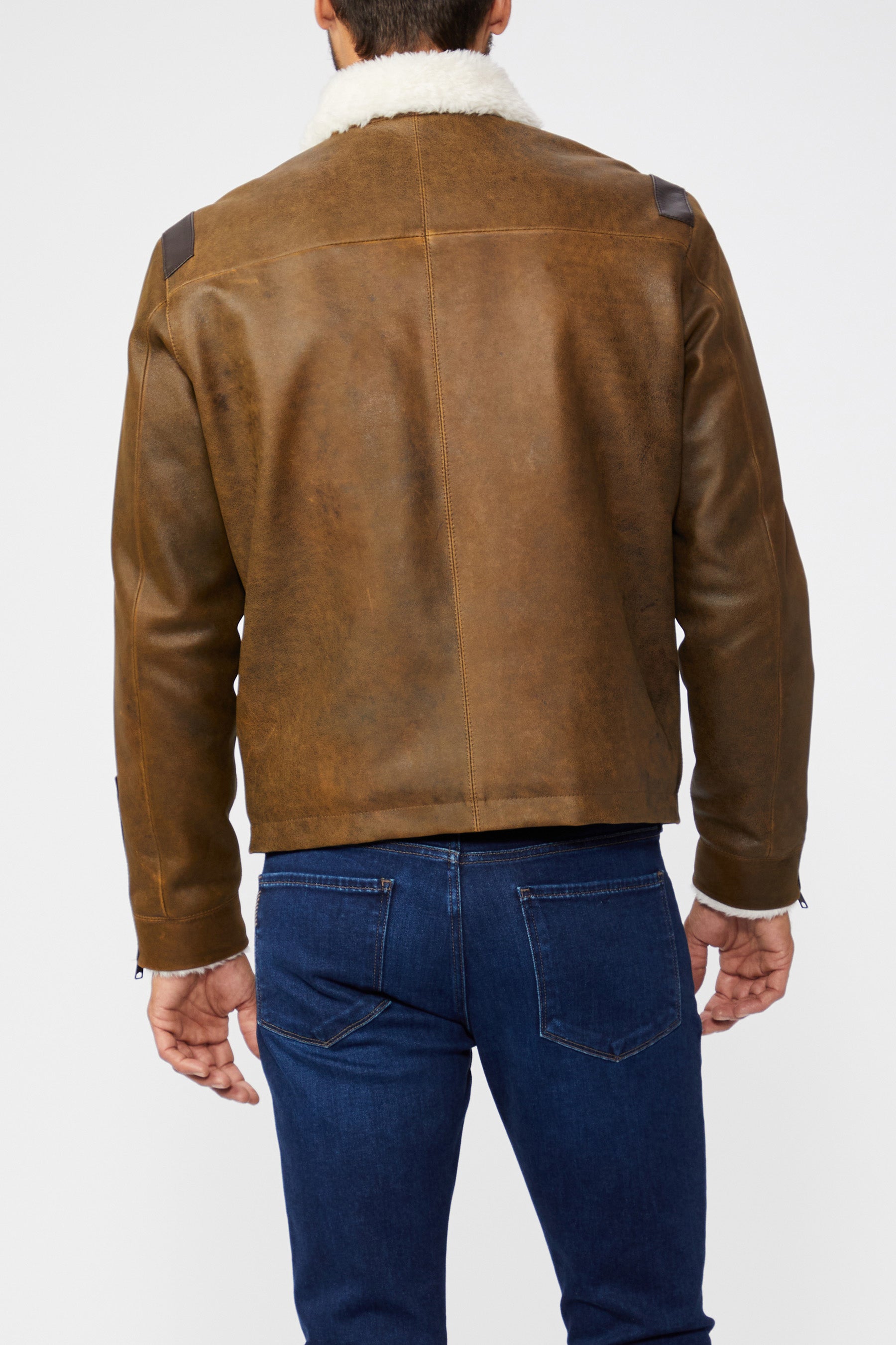 Brown leather jacket with white fur lining on a white background