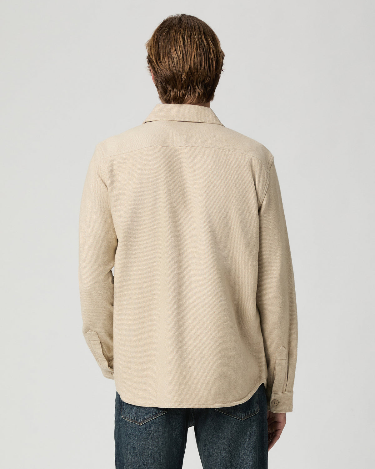 Back view of model wearing the Seymore Overshirt in Windrush Combo with dark jeans
