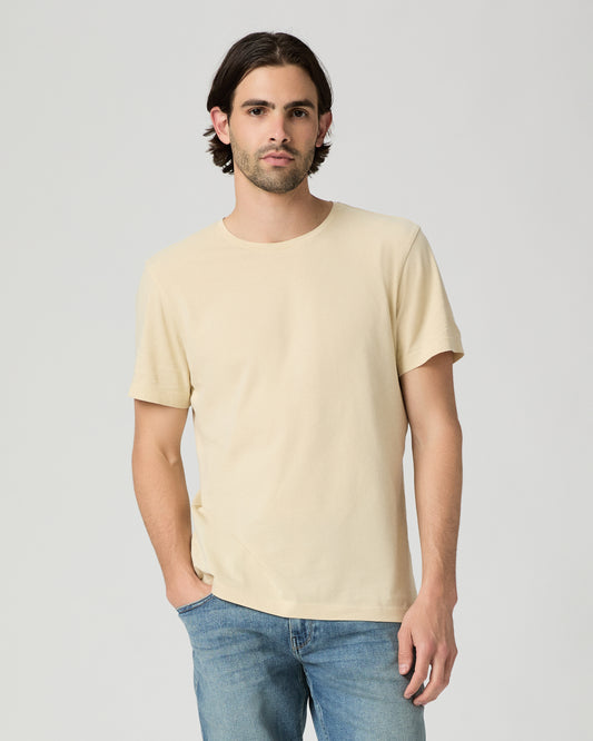 Man wearing light yellow with a medium wash jeans