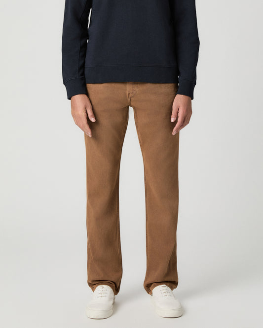 Front view from the waist down of the Normandie 32 Inch Straight Leg Jean in Vintage Sierra Canyon, a tan wash, worn with a navy sweater and white sneakers