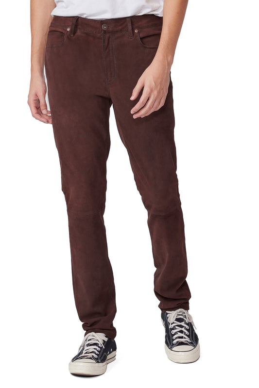 Brown pants worn by a person on a white background