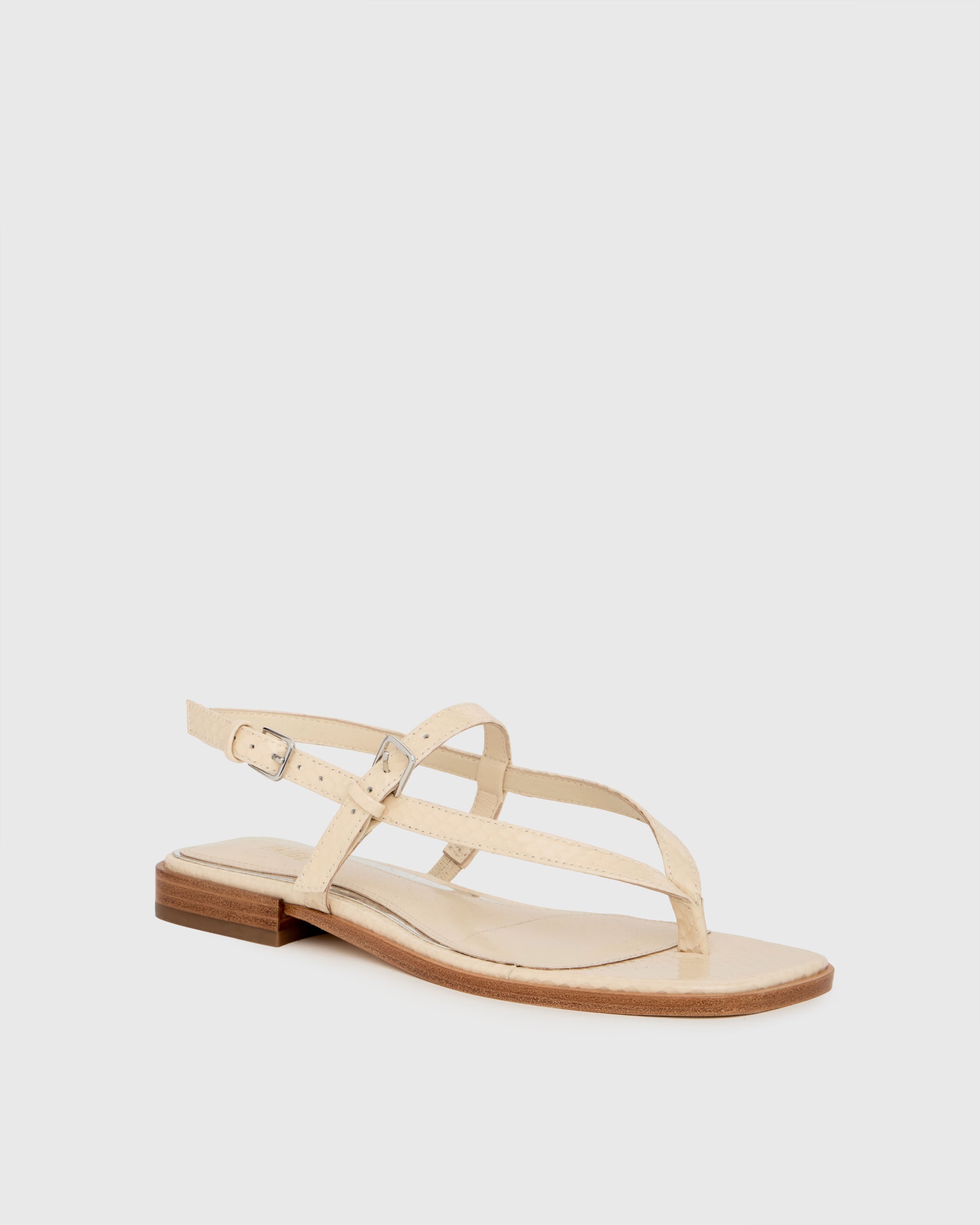 Beige sandal on a light gray background