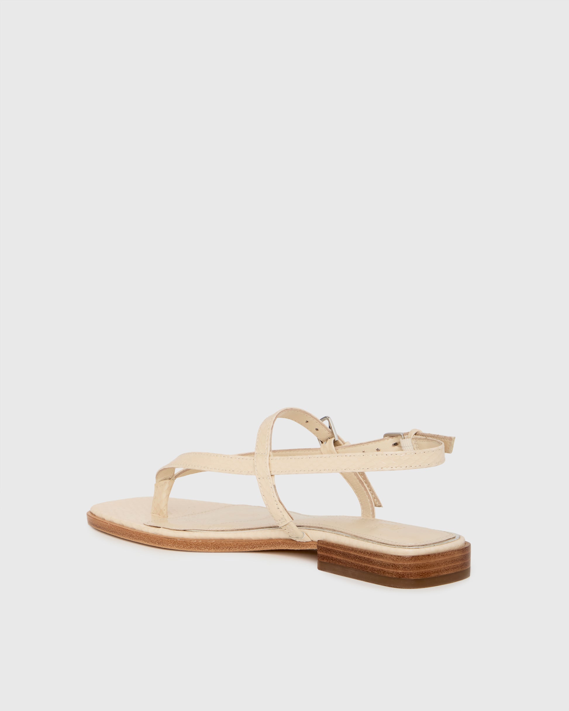 Beige sandal on a light gray background