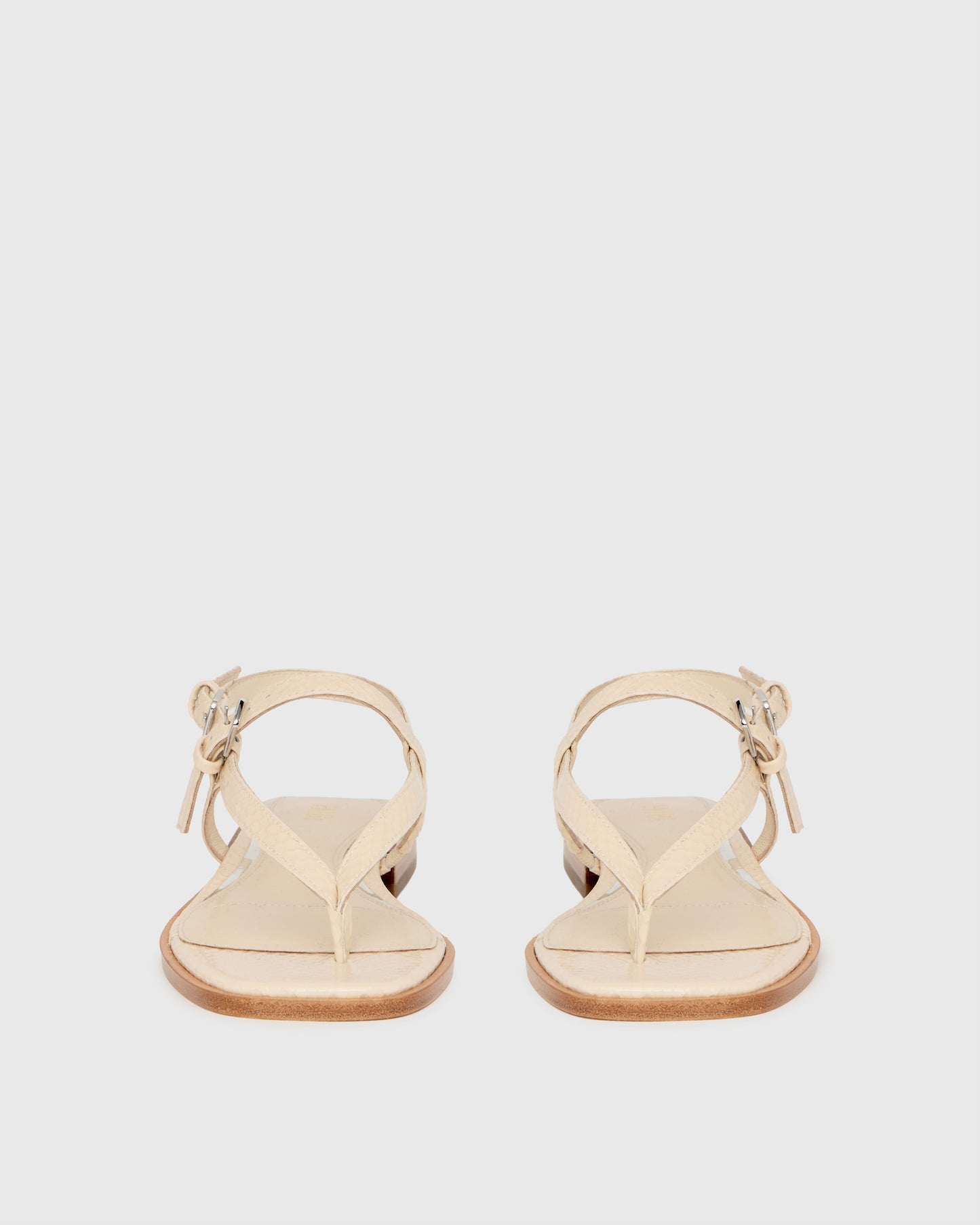 Beige sandal on a light gray background