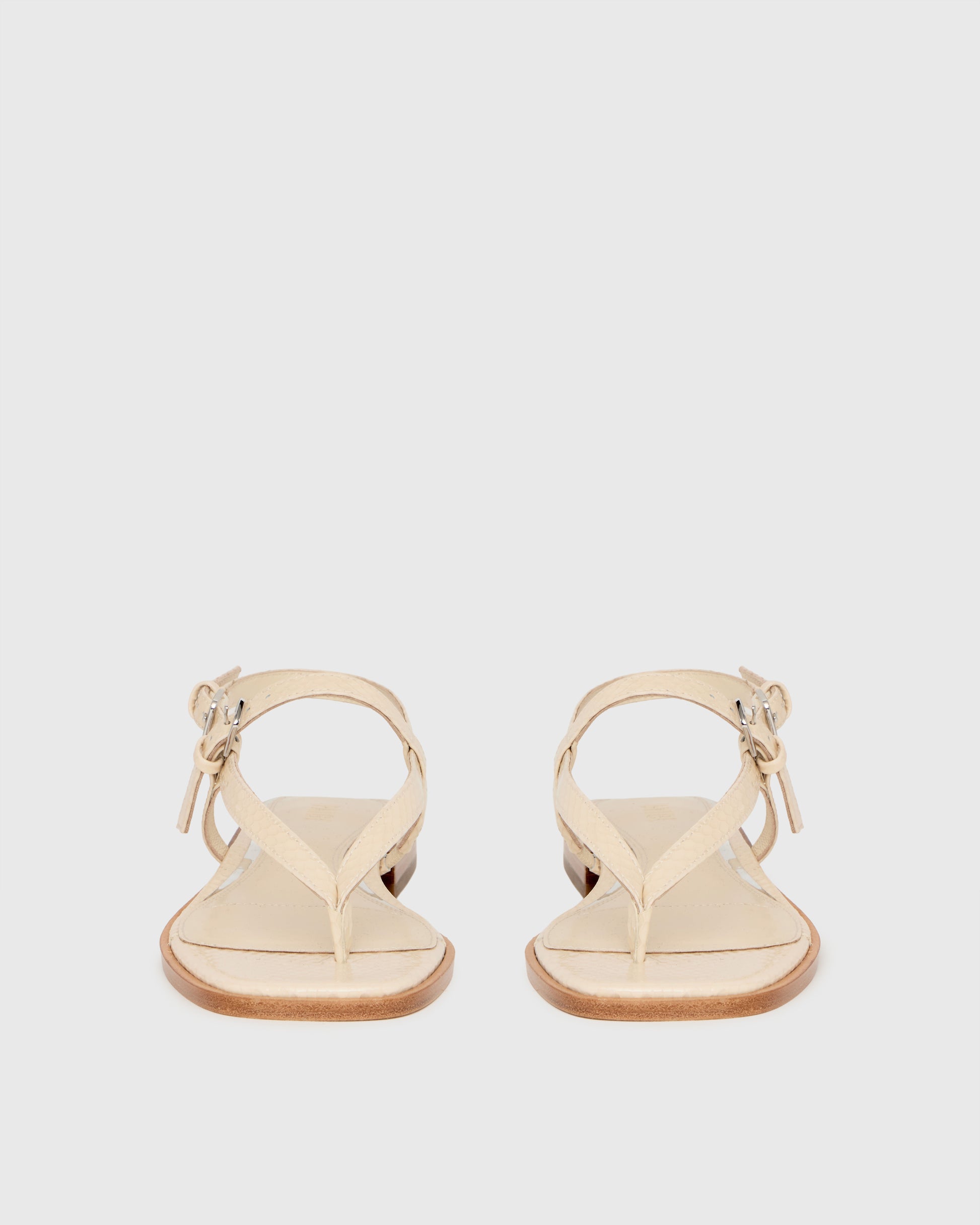 Beige sandal on a light gray background