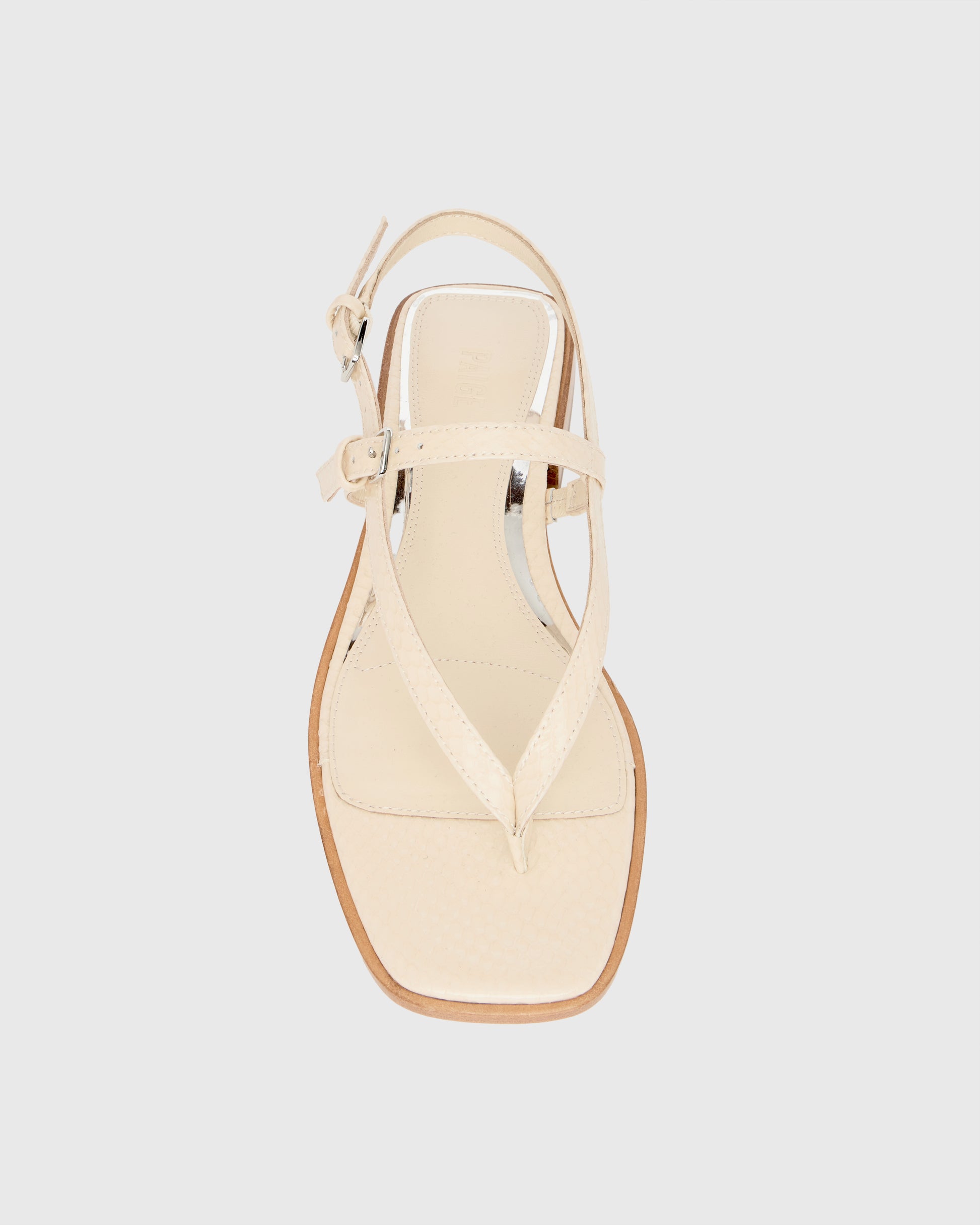 Beige sandal on a light gray background