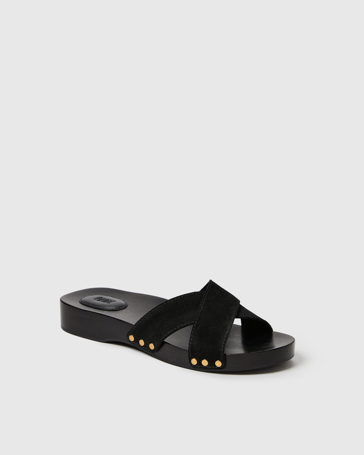 Black sandal with straps on a light gray background