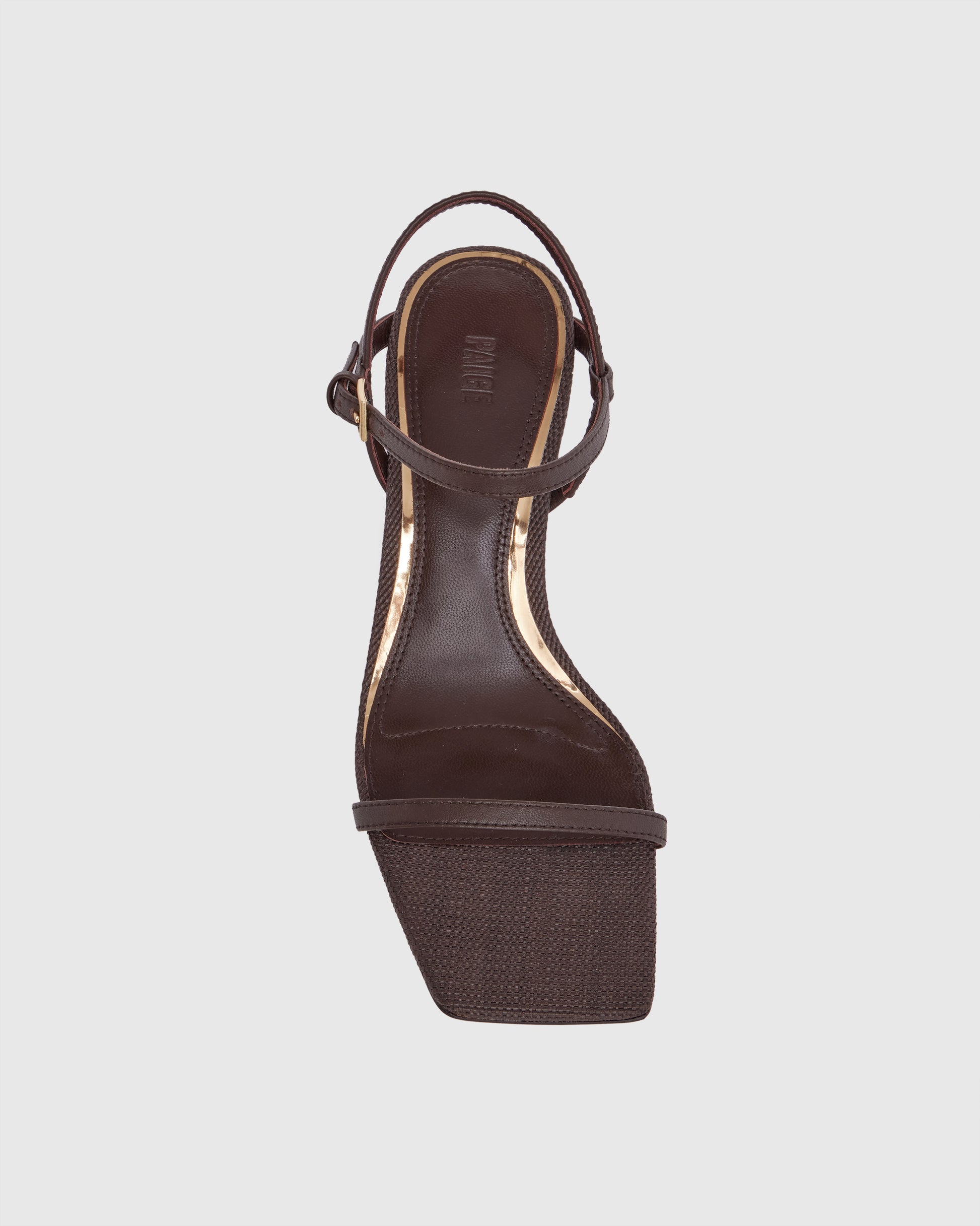 Brown high-heeled sandal with thin straps on a light gray background